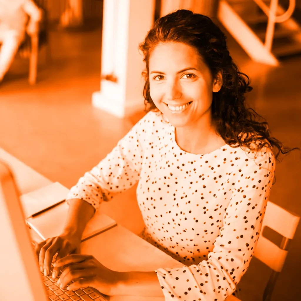 Woman typing on her PC keyboard