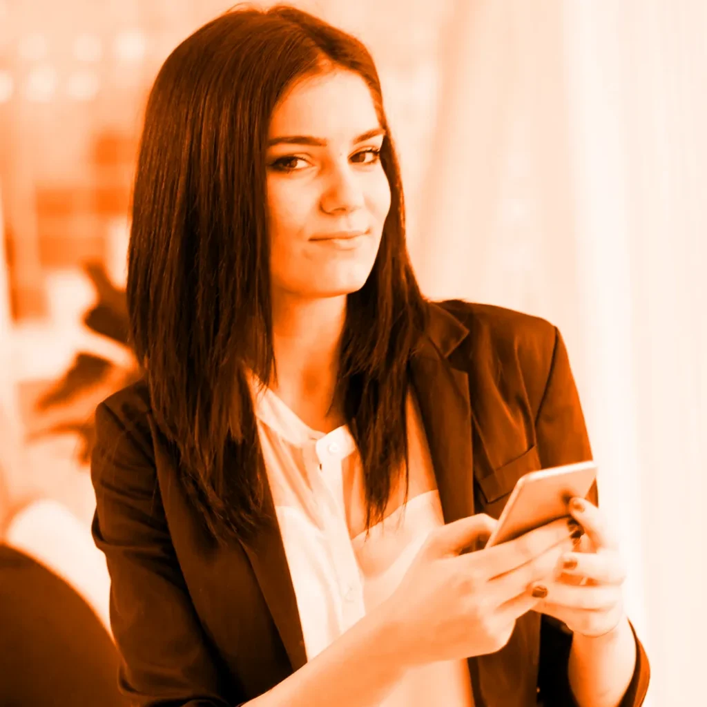 Business owner checking her Facebook ads on mobile phone